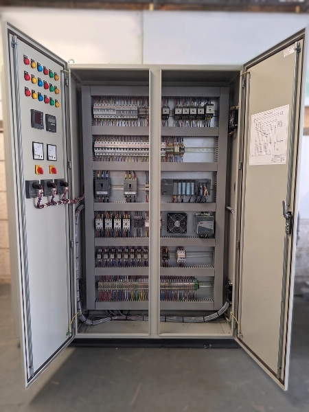 Lineup of medium voltage switchgear cabinets in a plant electrical building