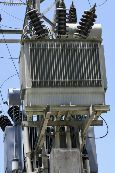 Row of live tank high voltage breakers in a utility switchyard